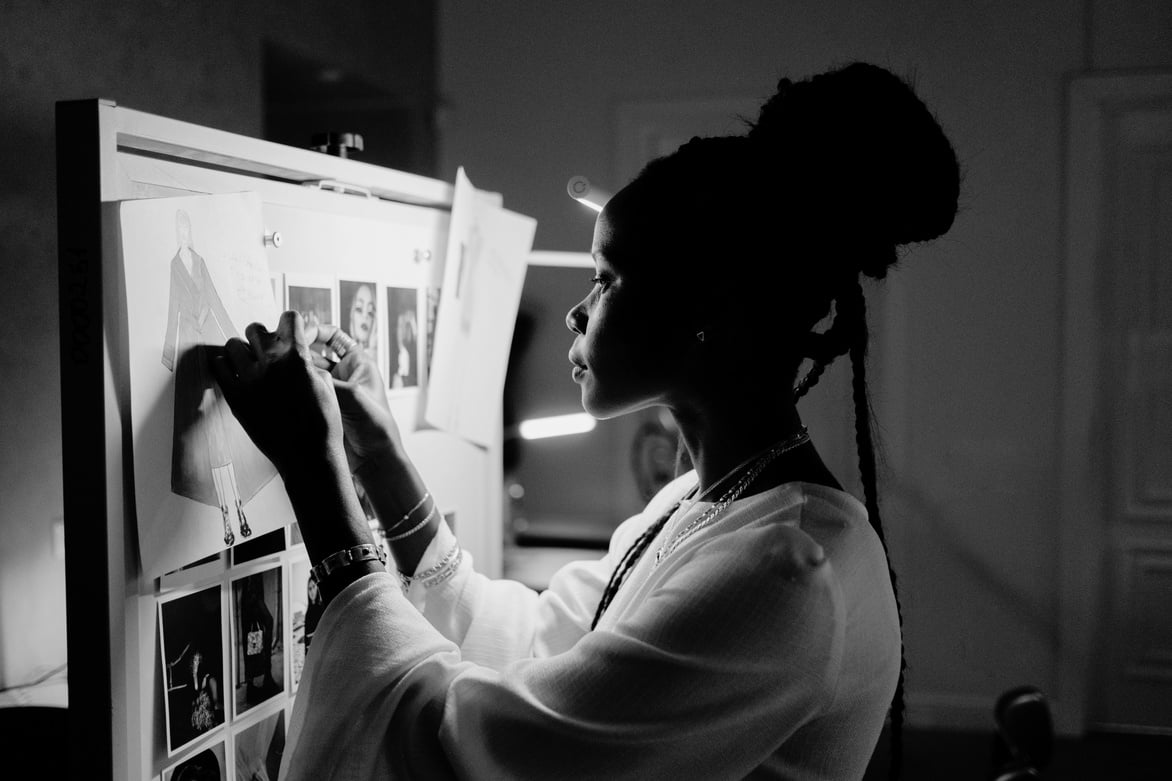 Fashion Designer Working on Whiteboard